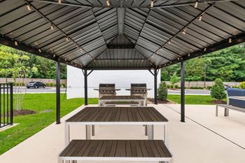 Grilling pavilion with tables and outdoor lighting